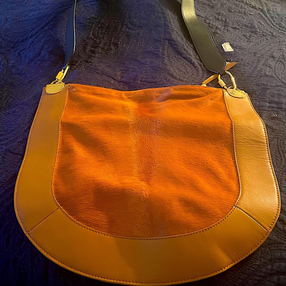 Selling high end purse only used four times. Great bad just have to many